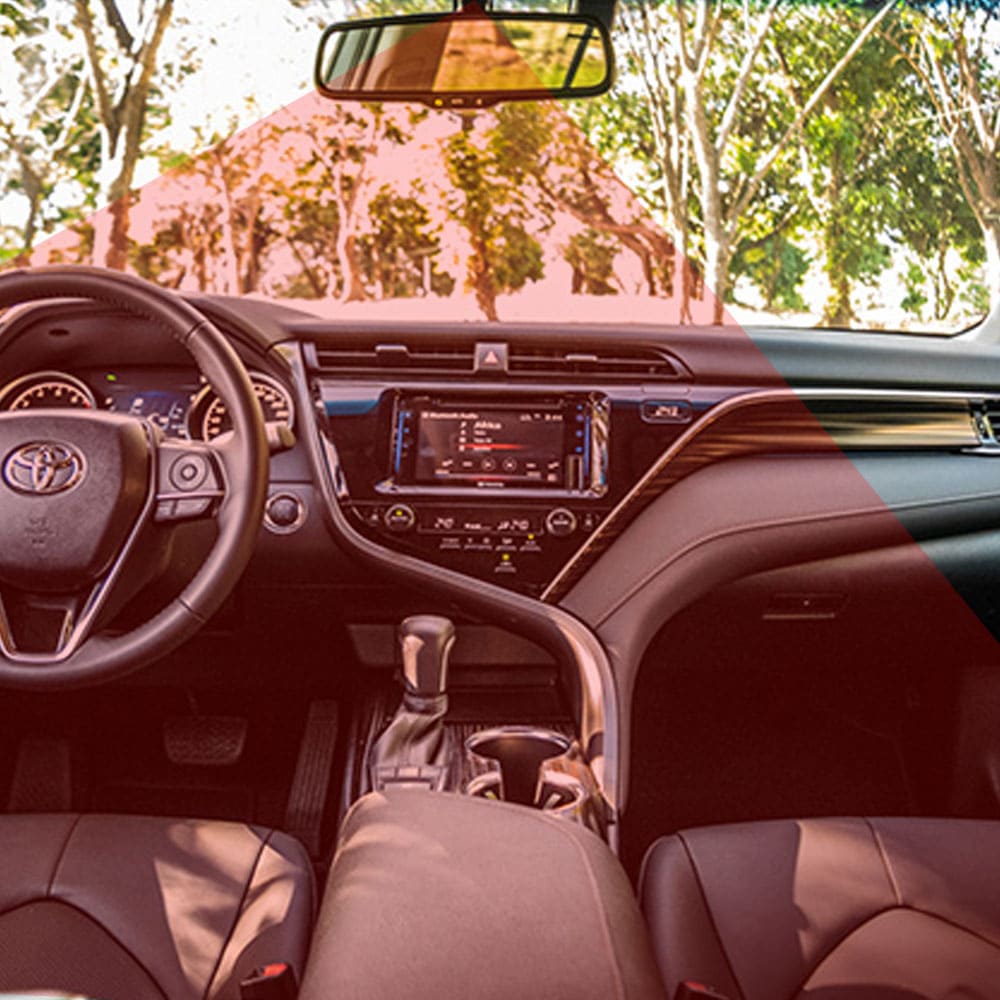 Dashboard display showing driver monitoring alerts and biometric sensor readouts in a modern connected vehicle
