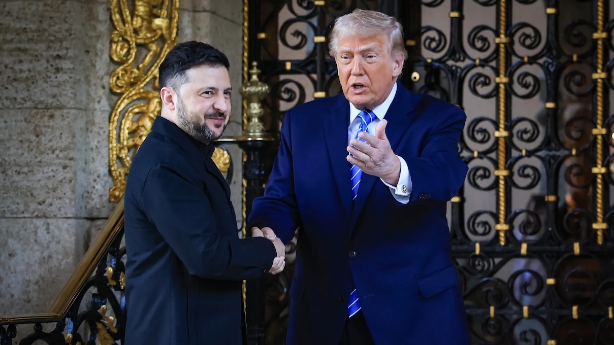 trump and zelensky seen shaking hands
