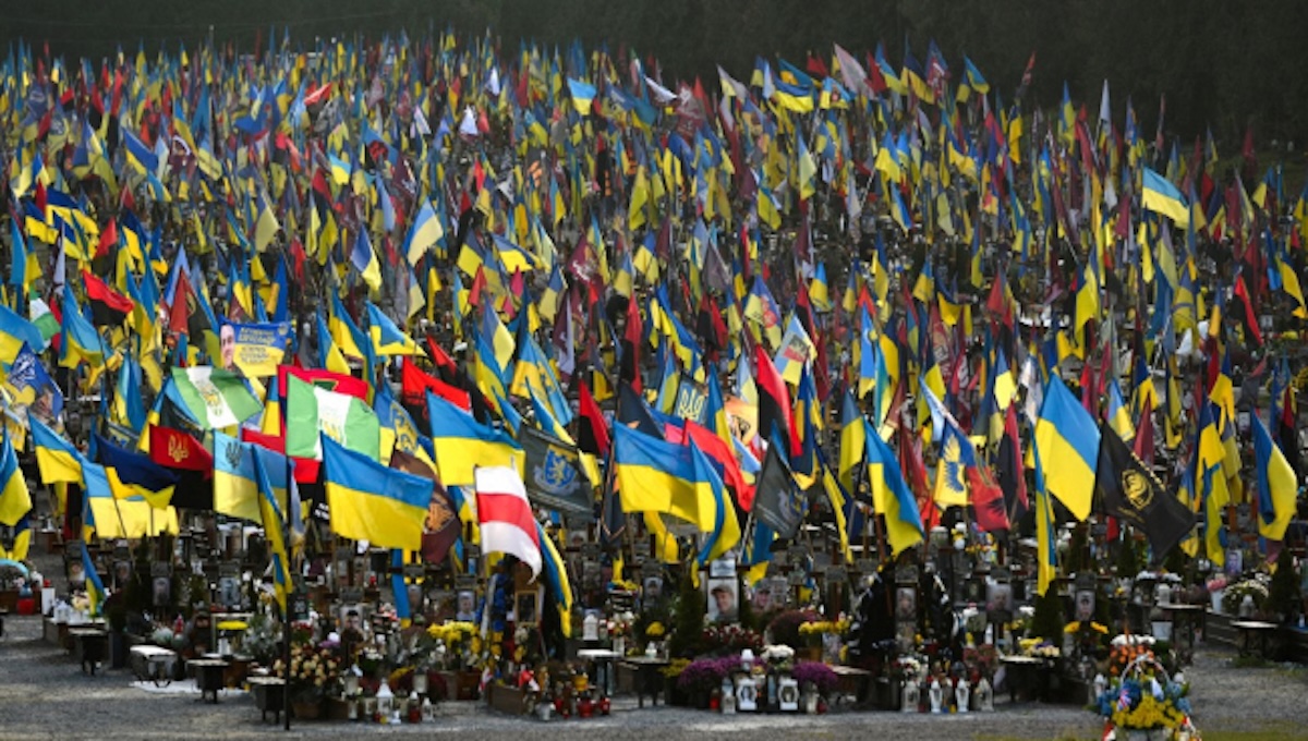 hundreds of Ukrainian graves covered in flags