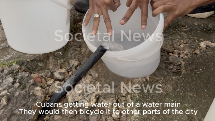 Cubans getting water out of a broken water main and bicycling back to other parts of the Havana Cuba